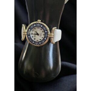 Vintage Avon BOUSSIVIE White Strap Blue Pearl Faced Ladies Quartz Watch